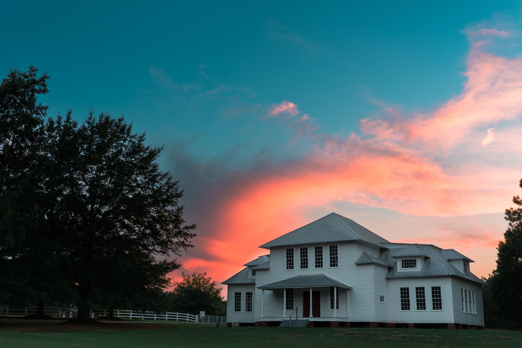 Dramatic orange sunset behind Central School House