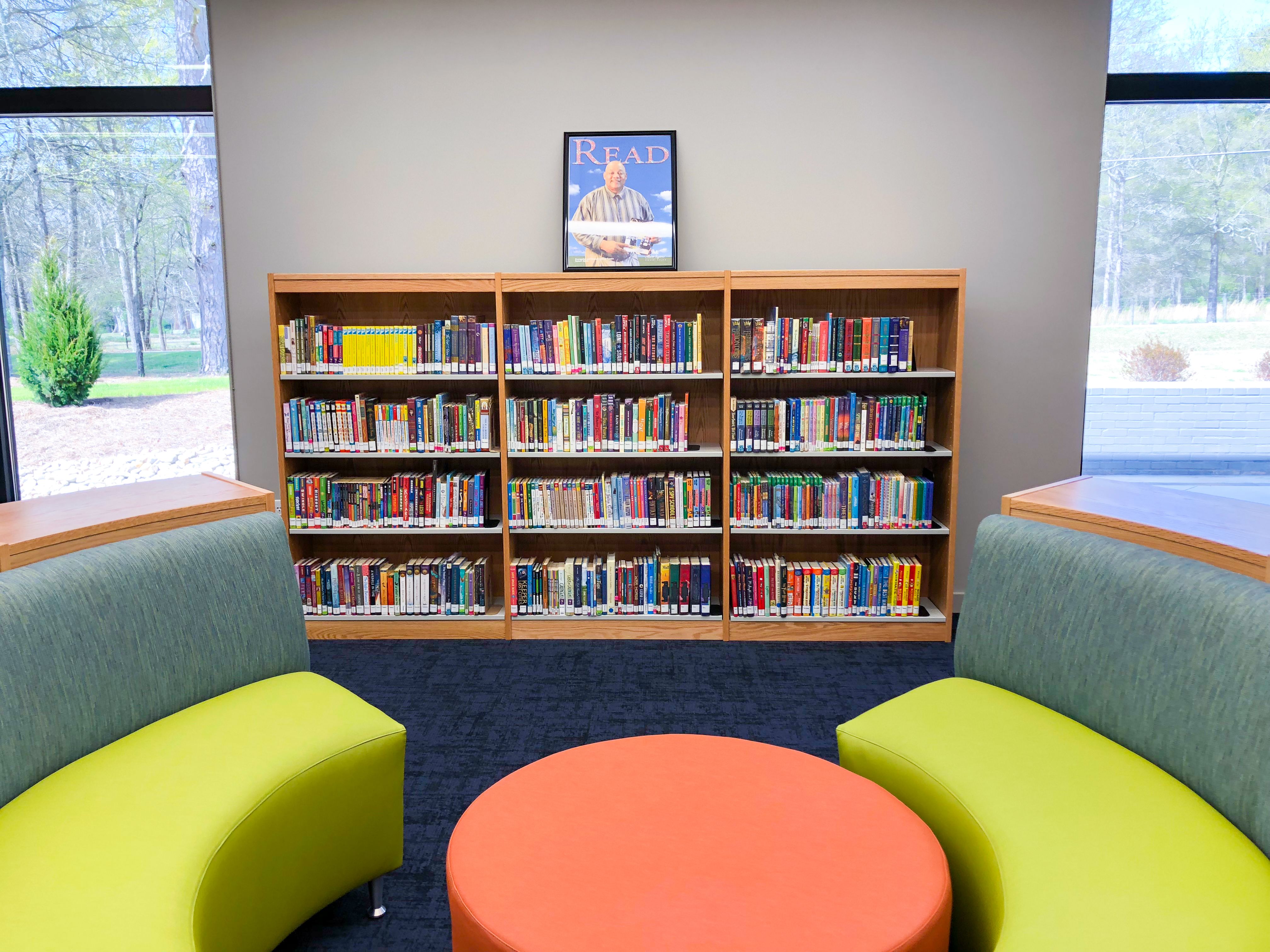 Colorful cushions and shelf of children's book at the Bogart Library