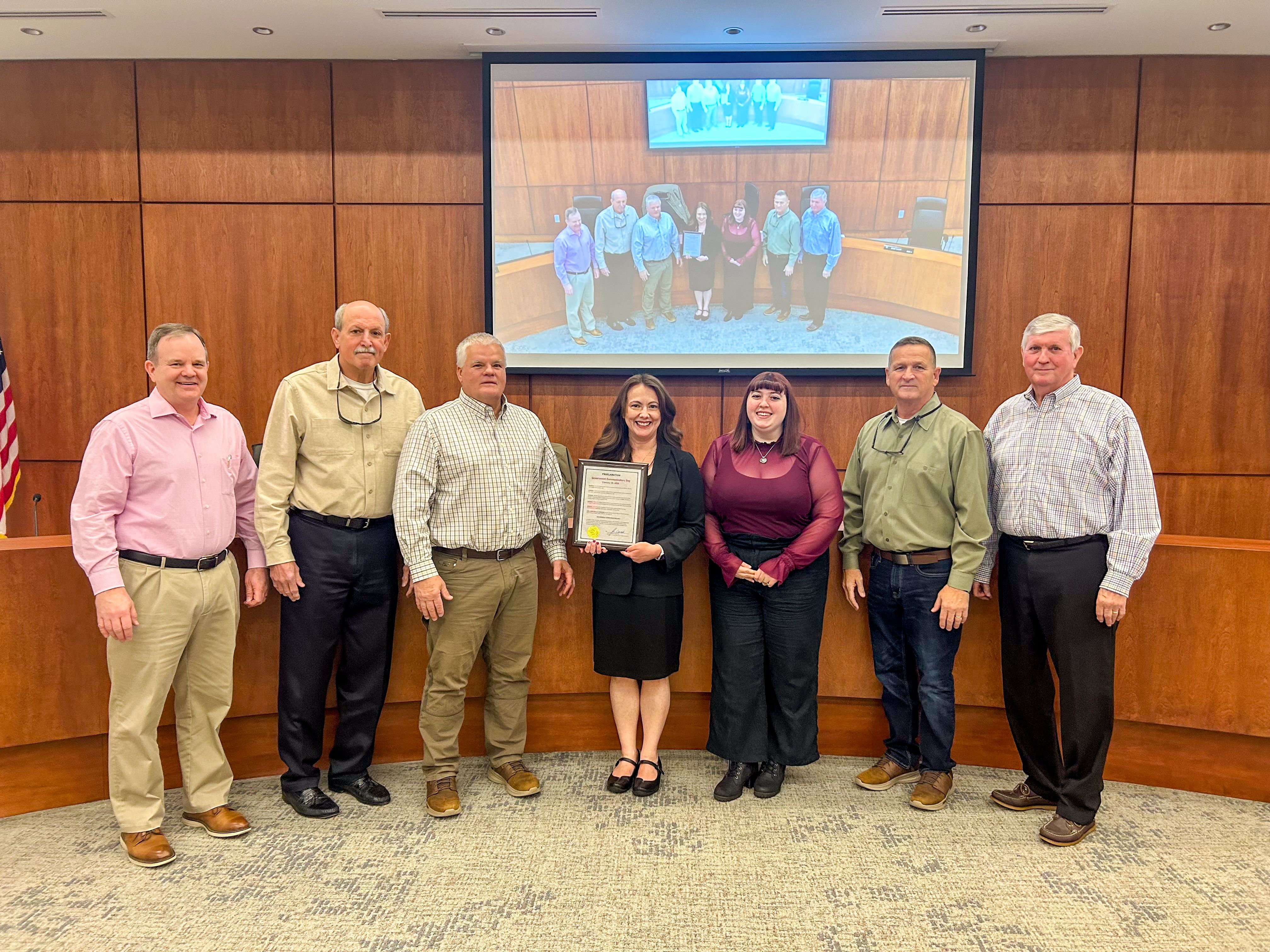 Commissioners present proclamation to Communications staff in the BOC Chamber