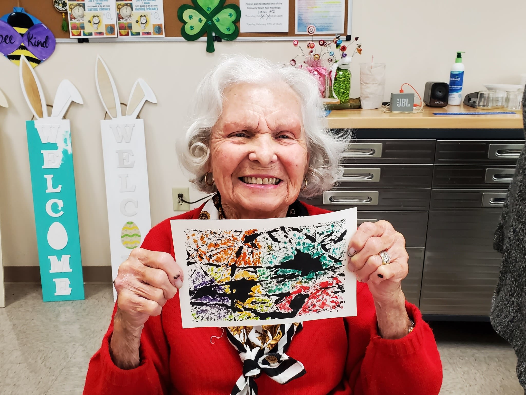 Senior Center member shows off her art work