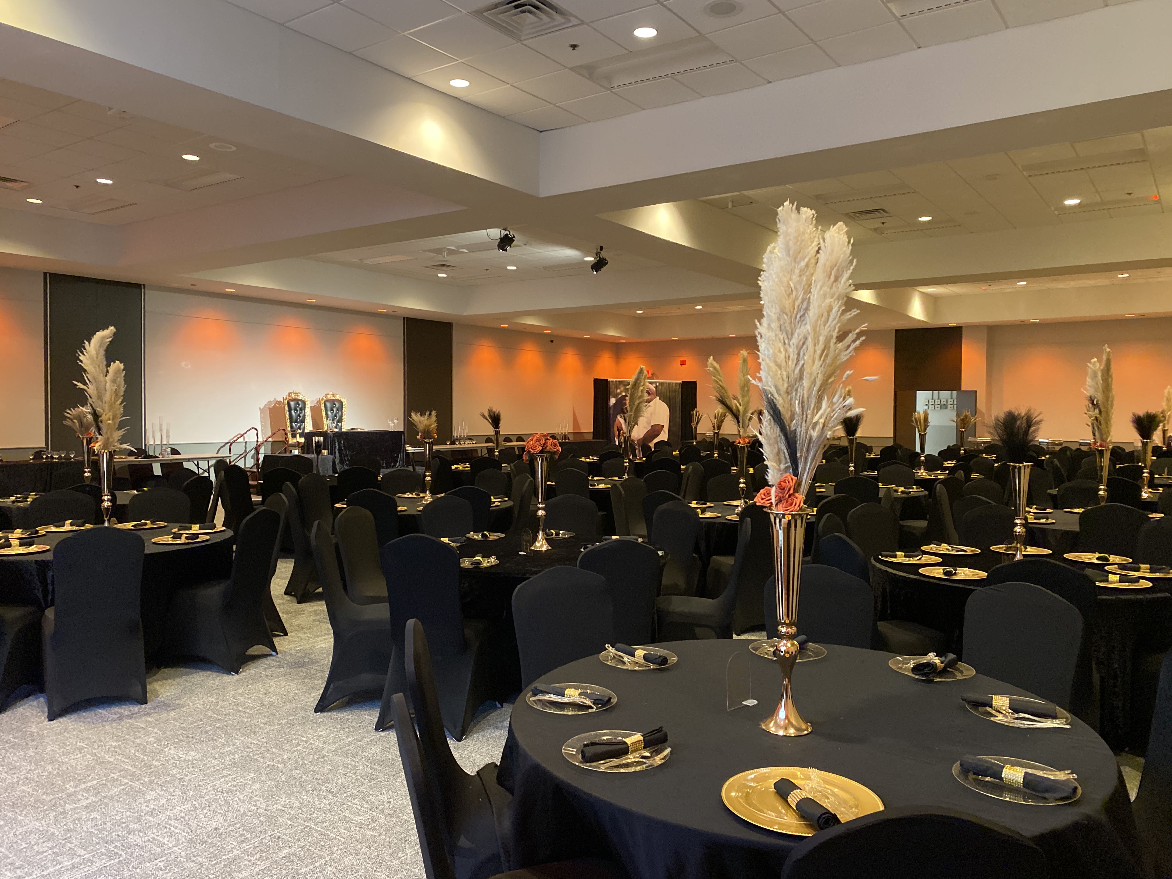 Civic Center banquet room with black, yellow and orange color theme